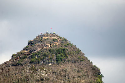 Rock formations on mountain against sky