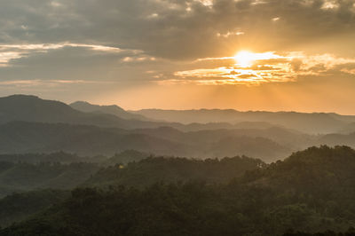 Scenic view of mountains against sky during sunset