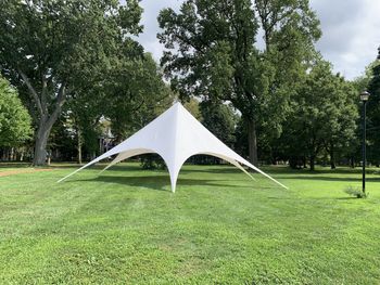 Tent in park against sky