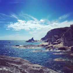 Scenic view of sea against blue sky