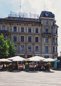 People in front of building