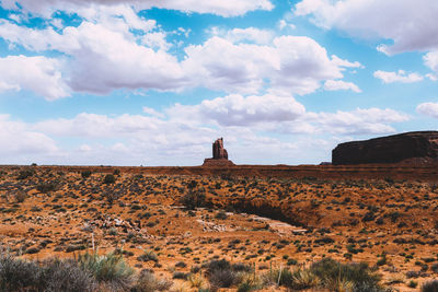 View of rock formations on landscape against sky