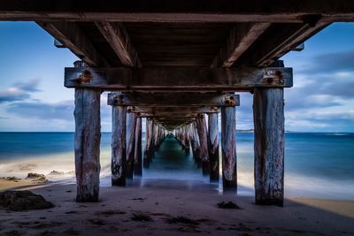 Pier over sea against sky