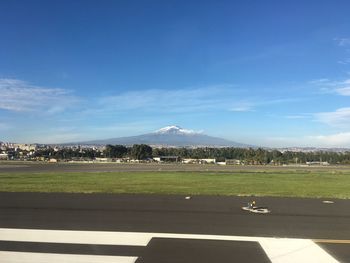 View of landscape against blue sky