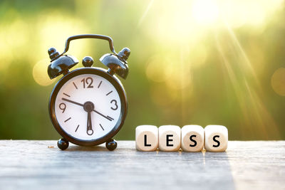 Close-up of alarm clock on table