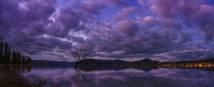 Panoramic view of lake against sky at sunset