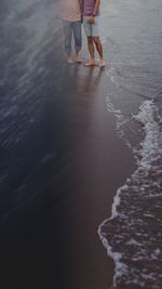 Low section of people on beach