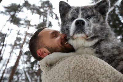 Portrait of young man with dog