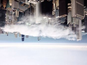 Buildings in city against sky