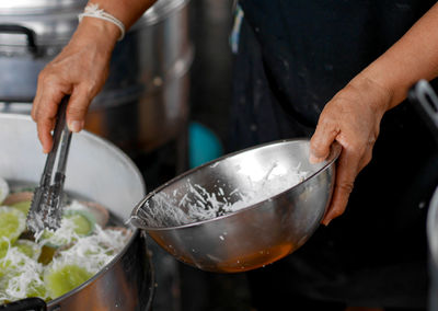 Midsection of man preparing food