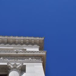 Low angle view of built structure against clear blue sky
