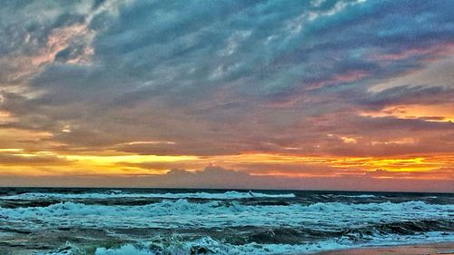 Scenic view of sea against dramatic sky