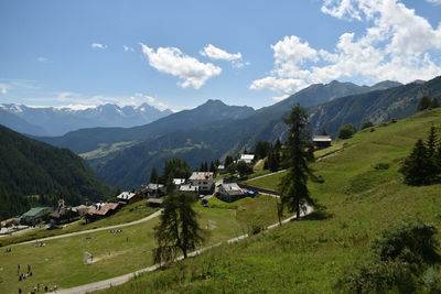 Scenic view of landscape and mountains against sky