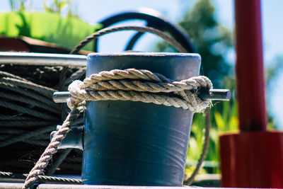 Close-up of rope tied up on metal