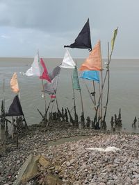 Umbrellas on beach against sky