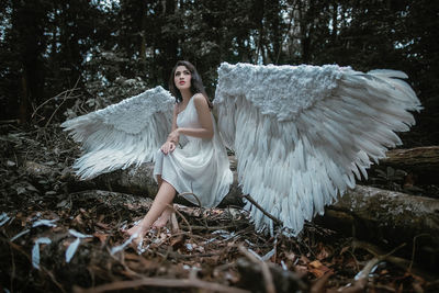 Full length of young woman in forest