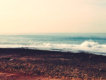 Scenic view of beach against clear sky