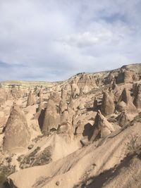 Rock formations in desert against sky