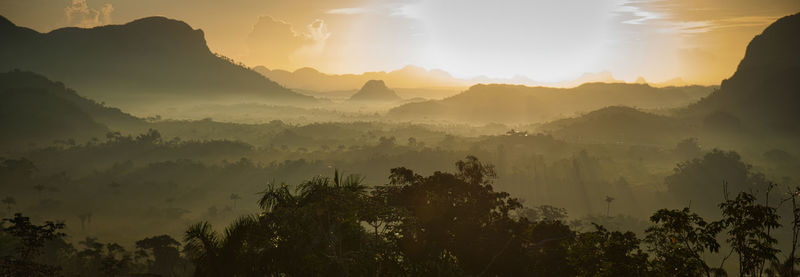 Scenic view of mountains against sky during sunset