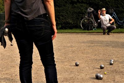 Rear view of men playing with ball