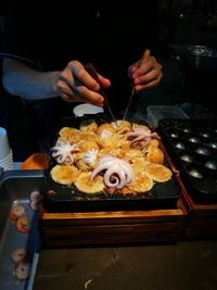 Close-up of man preparing food