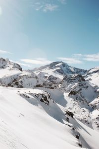 Scenic view of snowcapped mountains against sky