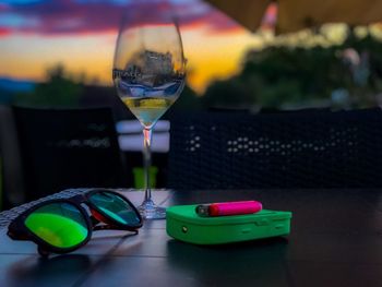 Close-up of wine glasses on table