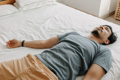 High angle view of baby sleeping on bed at home