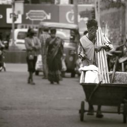 People walking on street in city