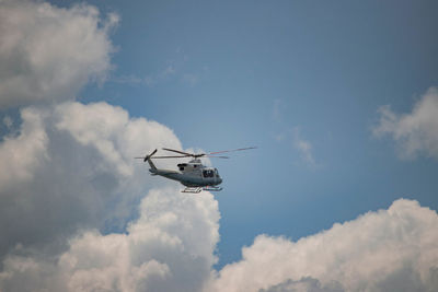 Low angle view of airplane flying in sky