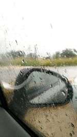 Close-up of raindrops on car window