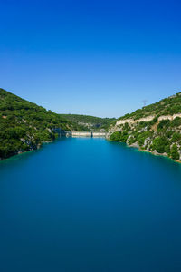 Scenic view of calm sea against clear sky