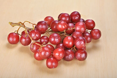 Close-up of red grapes on table