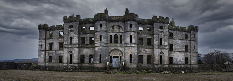 Low angle view of old ruins against sky