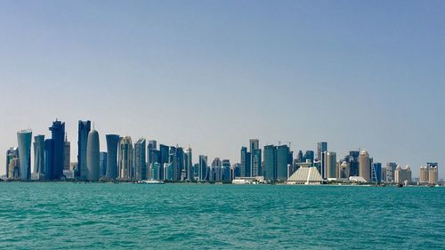 Sea with city in background