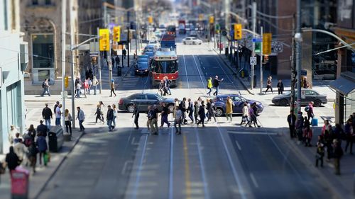 Group of people walking on city street
