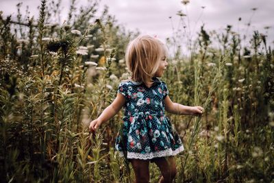 Girl standing on field