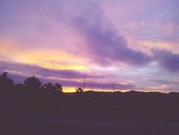 Silhouette landscape against scenic sky