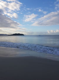 Scenic view of beach against sky during sunset