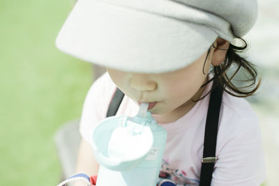 Close-up of girl drinking water 