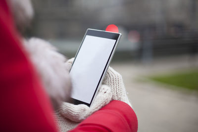 Close-up of hand holding mobile phone