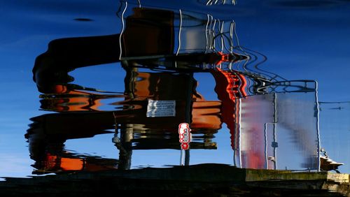 Low angle view of illuminated lamp against sky