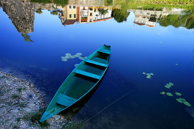 High angle view of boat moored in lake