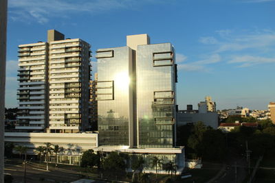 Buildings in city against sky