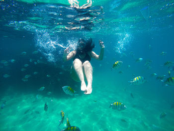 Young woman swimming in sea