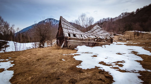 Demolished old wooden hut somewhere in the retezat mountains. desolated, abandoned places.