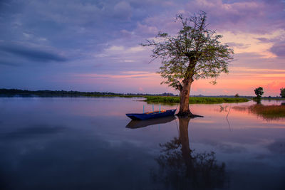 Scenic view of lake against sky during sunset