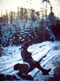 Shadow of person on snow covered land