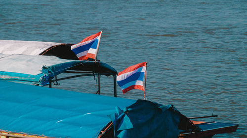 Flag on boat in sea