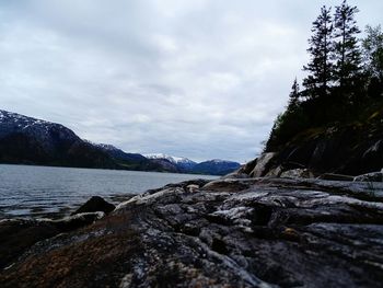 Scenic view of mountains against cloudy sky